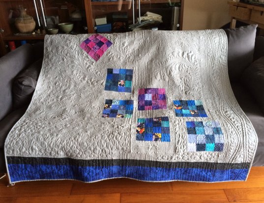 Quilt back over couch